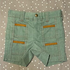 Vintage army green kids shorts with leatherette accents.